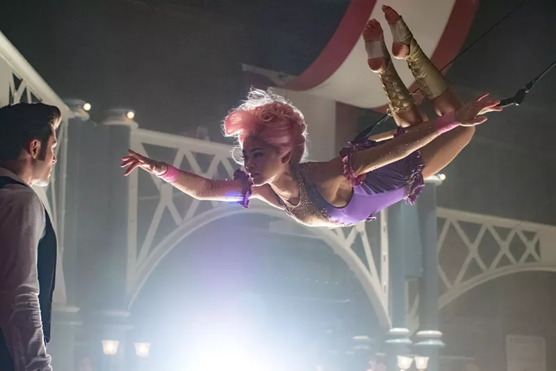 Image: Zac Efron (left, as Phillip Carlyle) and Zendaya (as trapeze artist Anne Wheeler) are paired during a music number in The Greatest Showman that's a genuinely thrilling moment.