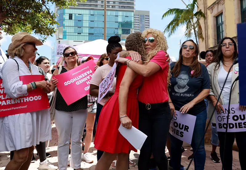 Image: Rachel Friedland (right) hugs U.S. Rep. Debbie Wasserman Schultz on May 3, 2022, at a rally supporting guaranteed federal abortion rights.