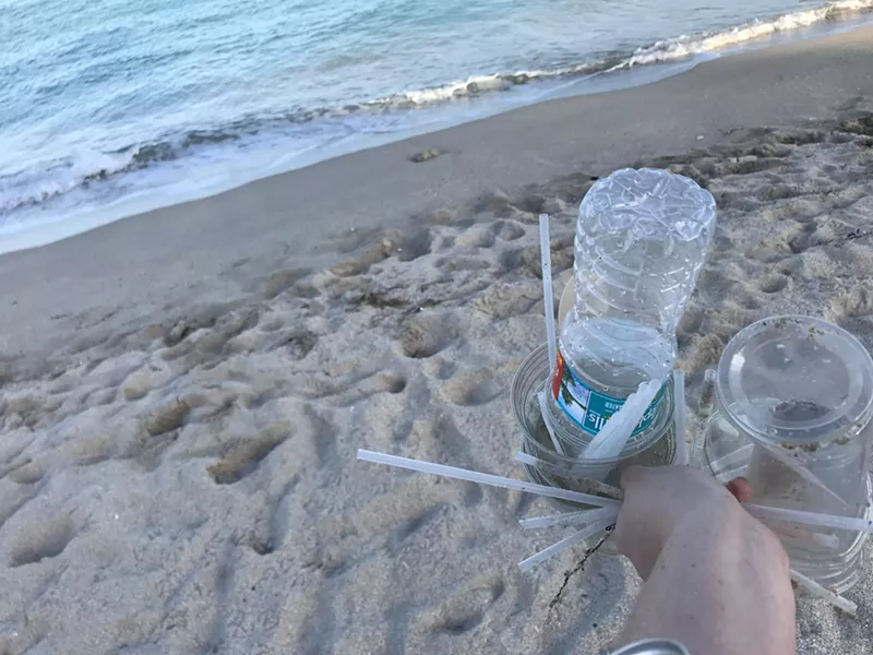 Image: At a beach cleanup in Surfside earlier this year, Jennifer Rotker found dozens of plastic straws littering the shore.