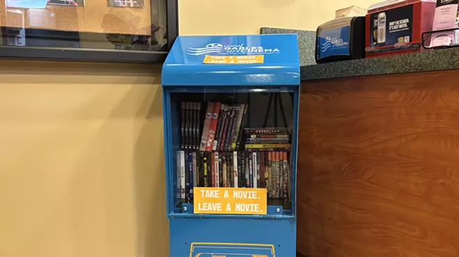 A Free Blockbuster stand inside a movie theater