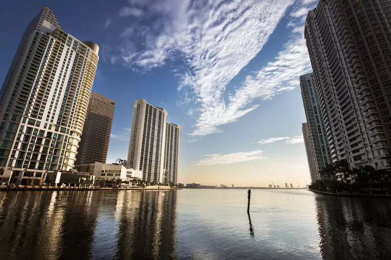 Image: Skyscrapers sit above the water in Miami.