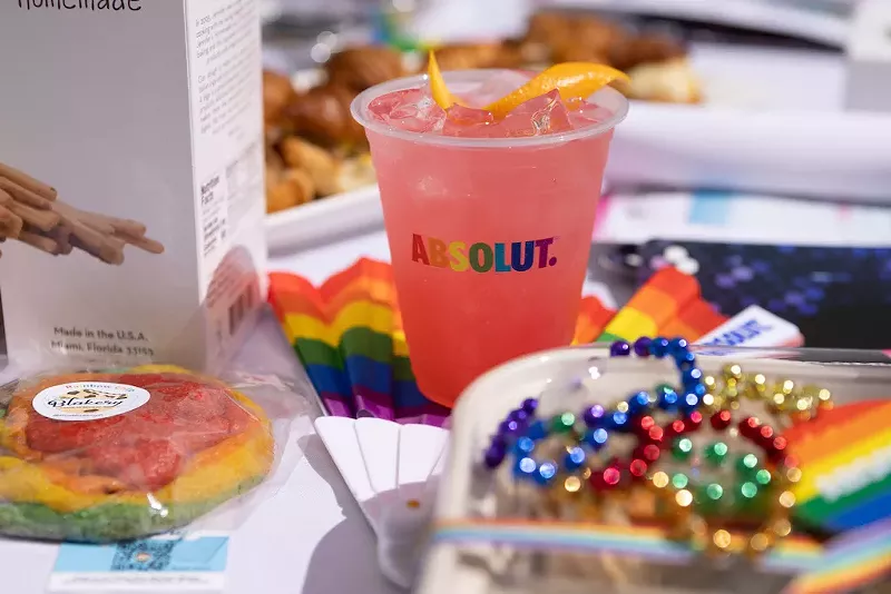 Image: A pink cocktail and rainbow beads