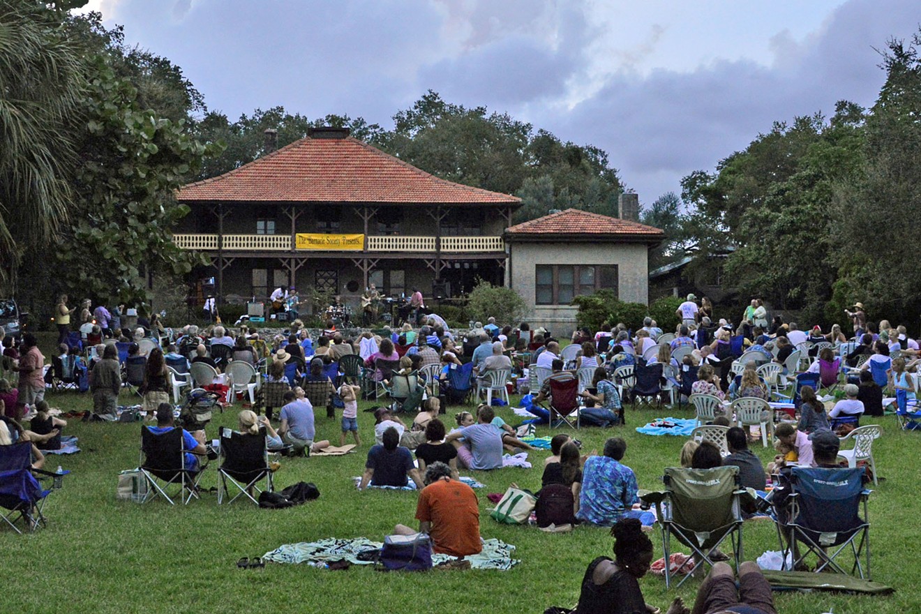 Concertgoers on the front lawn of the Barnacle.