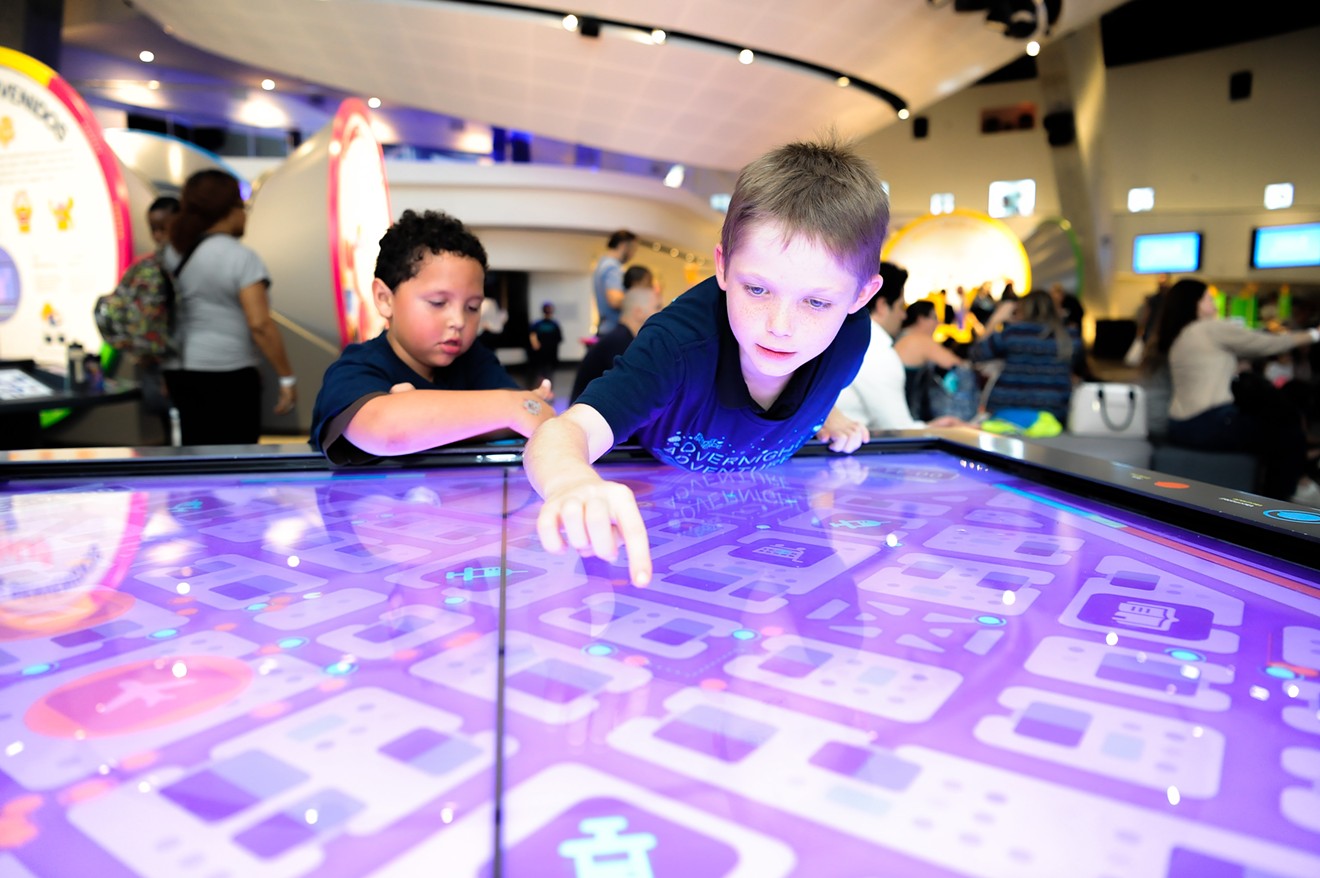 Kids explore the Phillip and Patricia Frost Museum of Science.