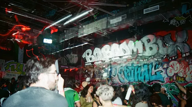 People dancing at a warehouse