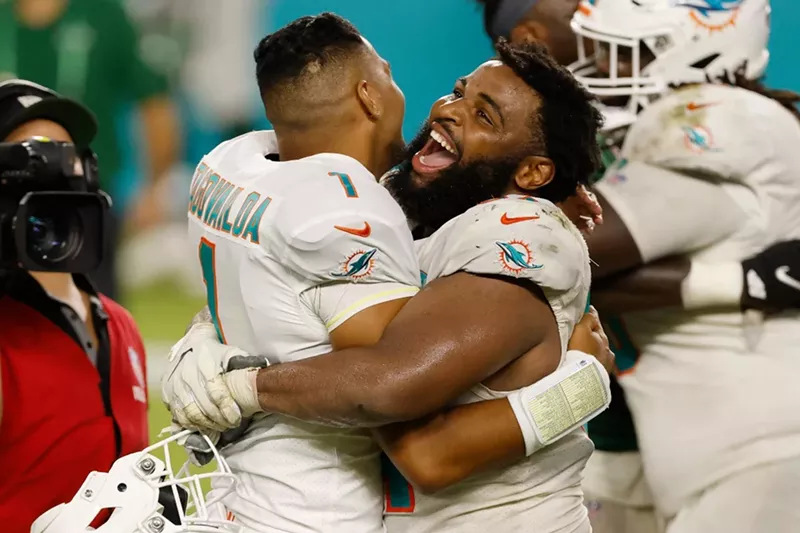 Image: Christian Wilkins celebrates with Tua Tagovailoa after he made his NFL debut against the New York Jets.