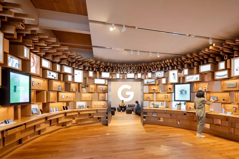 Image: view inside a Google store with wood interiors and shelves