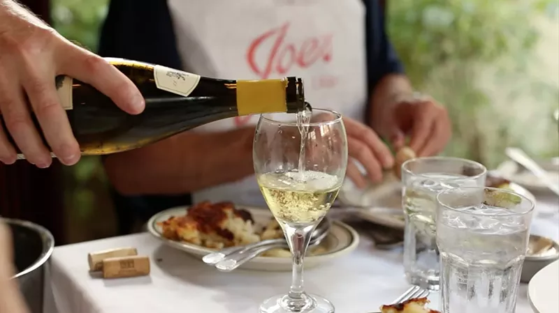 Image: Patrons enjoy a meal and glass of wine at Joe's Stone Crab in Miami Beach.