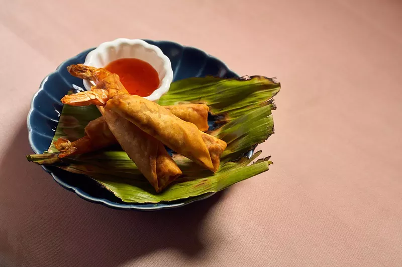 Image: Asian food on a plate with pink background