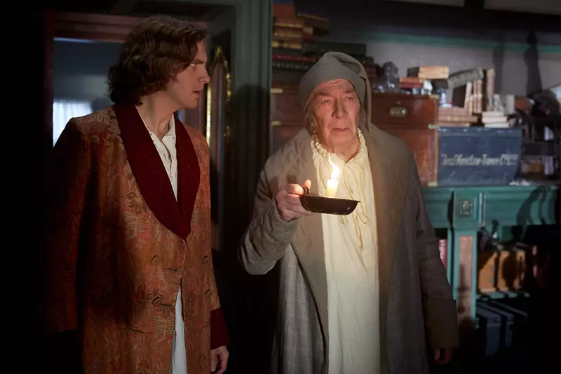 Image: In The Man Who Invented Christmas, Dan Stevens (left) plays Charles Dickens, the English novelist who not only wrote A Christmas Carol but also created the character of Ebenezer Scrooge, brought to life here by Christopher Plummer.