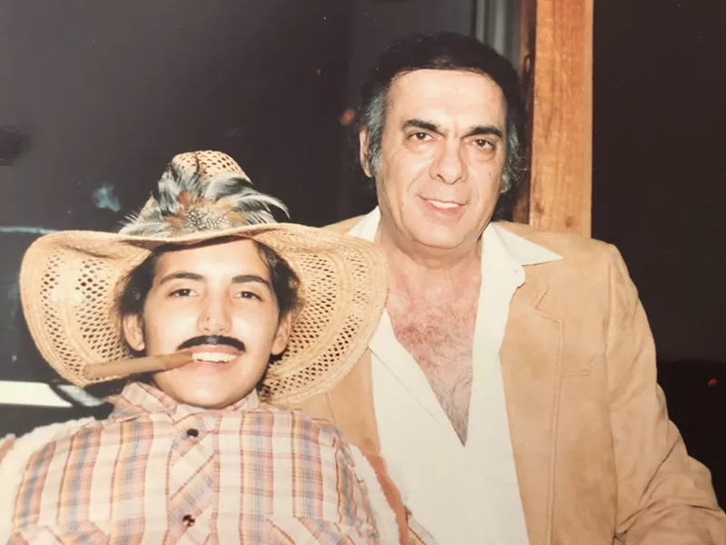Image: Bernardo de Torres with one of his children on Halloween at the Mutiny Hotel circa the 1980s.