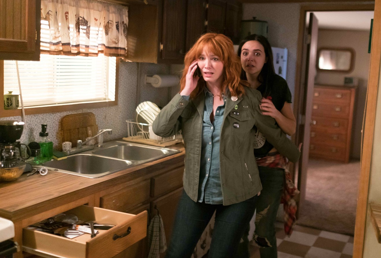 Christina Hendricks (left) plays Cindy, the mother of rebellious teenager Kinsey (Bailee Madison), in a family that gets terrorized by a murderous trio in The Strangers: Prey at Night.