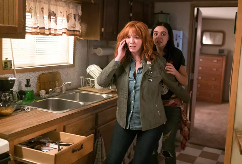 Image: Christina Hendricks (left) plays Cindy, the mother of rebellious teenager Kinsey (Bailee Madison), in a family that gets terrorized by a murderous trio in The Strangers: Prey at Night.