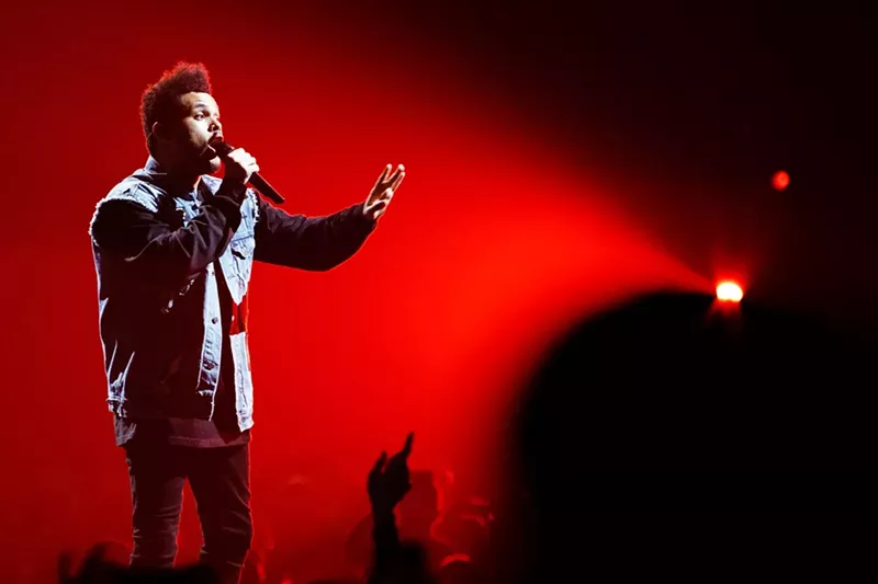 Image: The Weeknd commands the mike and the stage at the BB&T Center. See more photos from the Weeknd's performance here.