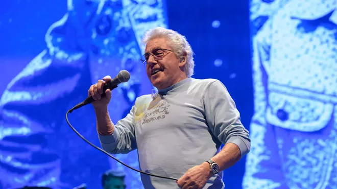 Roger Daltrey singing on stage