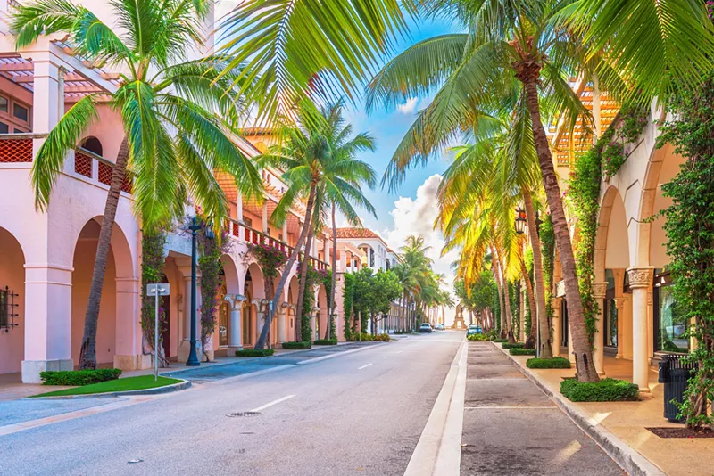 Image: Palm-tree-lined ultra-posh commercial district in Palm Beach