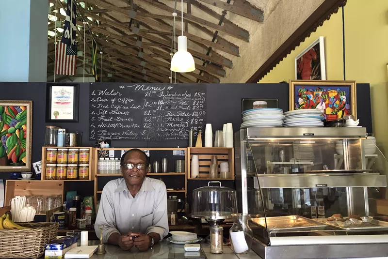 Image: George Laguerre, founder of Tigeorges Kafe in the Caribbean Marketplace, incorporates Haitian culture into the coffee world.