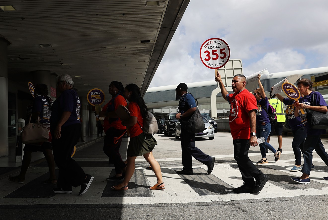 Airport workers protest for fair wages, union rights, paid sick leave, and safe workplaces at Miami International Airport in 2018.