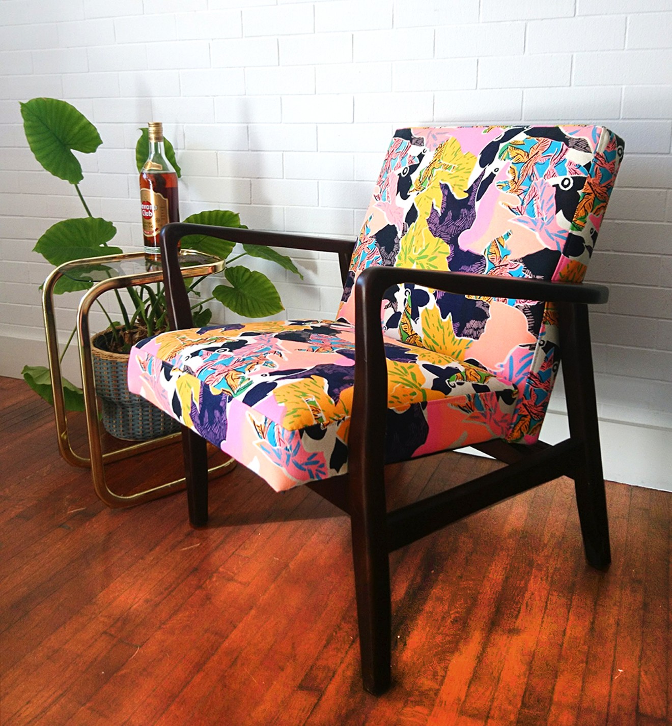 A midcentury chair reupholstered in a Tranqui Prints custom fabric.