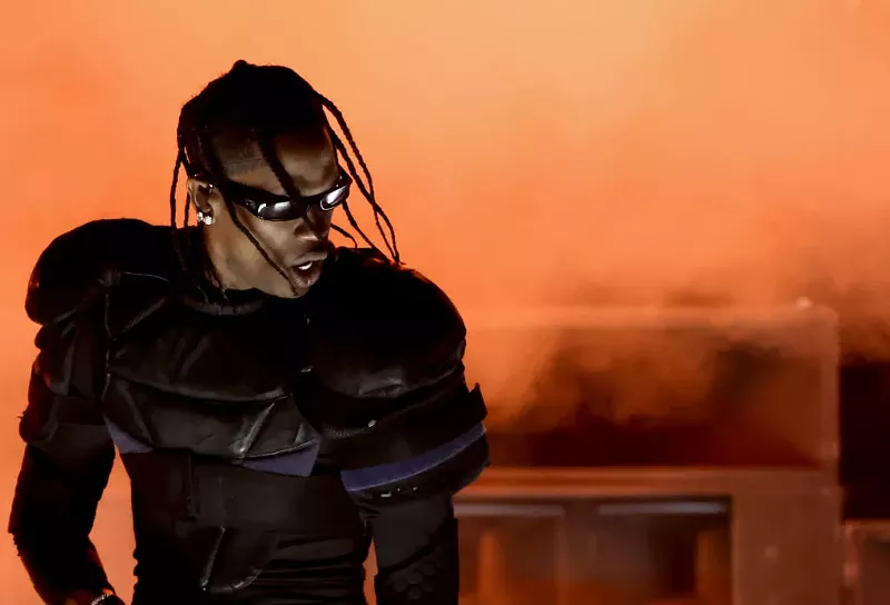 Image: Rapper Travis Scott in sunglasses and armor-like clothing on stage at the Grammy Awards