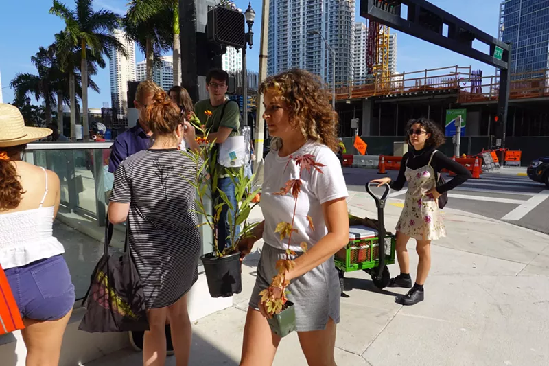 Image: Artist Jenna Balfe prepares to offer plants to the Tequesta Circle in Downtown Miami.