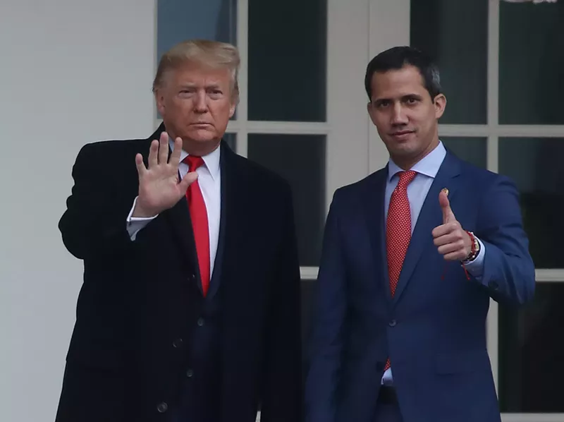 Image: President Donald Trump walks with Juan Guaidó, interim president of Venezuela, at the White House February 5.