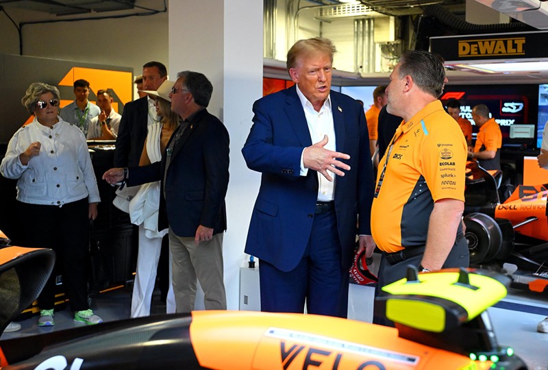 Donald Trump chats with McLaren Chief Executive Officer Zak Brown in the McLaren garage before the Grand Prix of Miami on May 5, 2024.