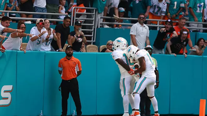Tyreek Hill #10 and Jaylen Waddle #17 of the Miami Dolphins celebrate after Hill's receiving touchdown during the third quarter against the Jacksonville Jaguars at Hard Rock Stadium on September 8, 2024, in Miami Gardens, Florida.