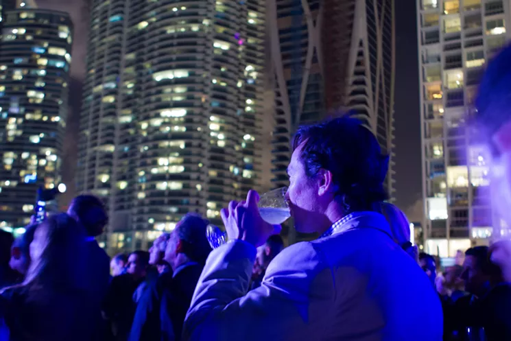 The rooftop of the Frost Museum of Science was abuzz with revelers celebrating the milestone. - PHOTO BY TRAVIS COHEN