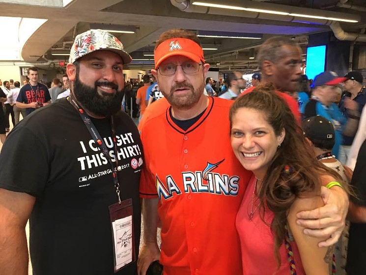 Laurence Leavy, AKA Marlins Man (center), and friends. - PHOTO BY TIM ELFRINK