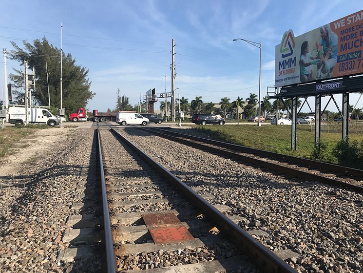 Lee Schaller died just south of this Tri-Rail crossing near West Copans Road in Broward. - PHOTO BY MEG O'CONNOR