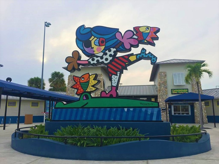 The entrance to Grapeland Water Park features a Romero Britto sculpture. - PHOTO BY CATHERINE TORUÑO