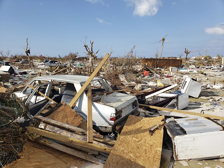 Crushed cars on the edge of the mostly Haitian shantytown called the Mudd. See more photos of the destruction on the Abaco Islands after Hurricane Dorian here. - PHOTO BY ZACHARY FAGENSON