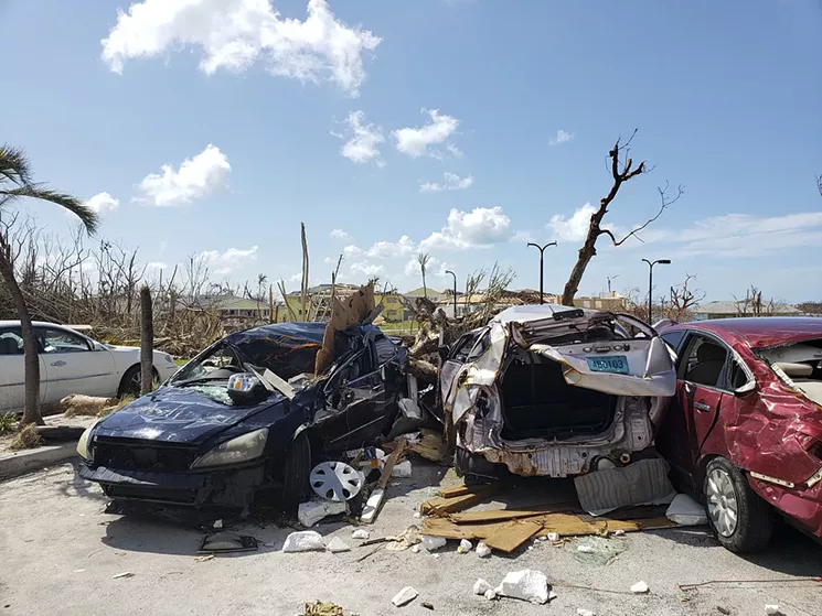 Crushed cars on the edge of the mostly Haitian shantytown called the Mudd. See more photos of the destruction on the Abaco Islands after Hurricane Dorian here. - PHOTO BY ZACHARY FAGENSON