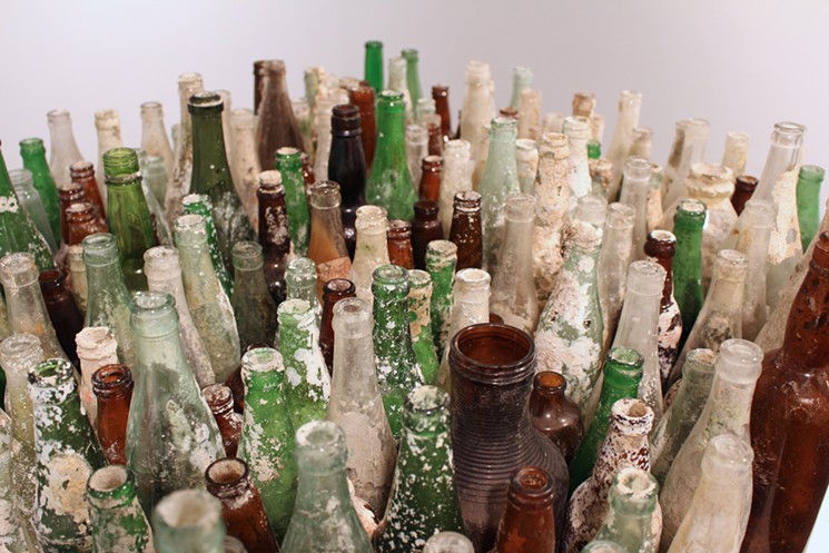 Stiltsville bottles made into art. - GUSTAVO OVIEDO