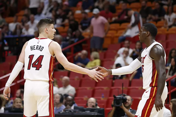 Tyler Herro celebrates with Kendrick Nunn against the Memphis Grizzlies during the second half on October 23, 2019. - PHOTO BY MICHAEL REAVES / GETTY