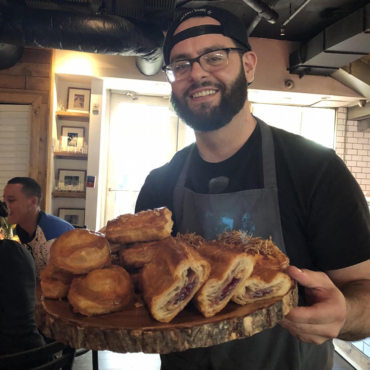 Giovanni Fesser, Miami's Pastelito Papi, holds a tray of his creations. - COURTESY OF BURGER BEAST