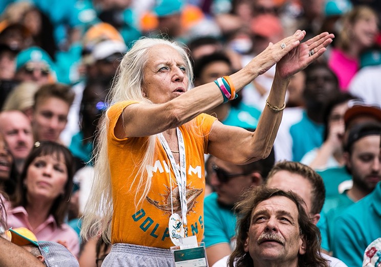 NFL fans left in awe of busty social media influencer at Miami Dolphins  game - but she doesn't even exist