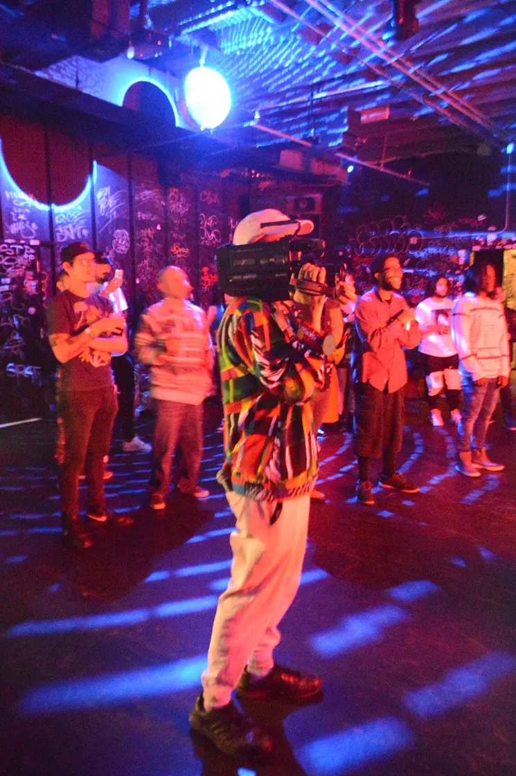 Ashiyushi, aka Joshua Hicks, films a performance at Bento Box with a VHS camcorder. - PHOTO BY JUAN CARLOS SACERIO