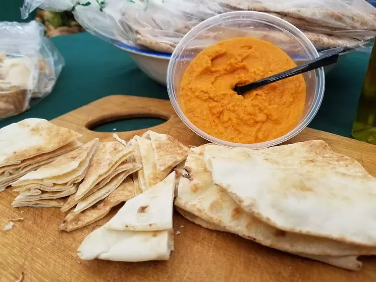 Mediterranean Delights is but one of the vendors participating in Merrick Park's drive-thru farmers' market. - THE FARMERS' MARKET AT MERRICK PARK