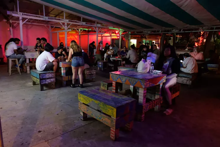 About 100 people gathered at Gramps Tuesday night to watch the first presidential debate. - PHOTO BY OLIVIA MCAULEY