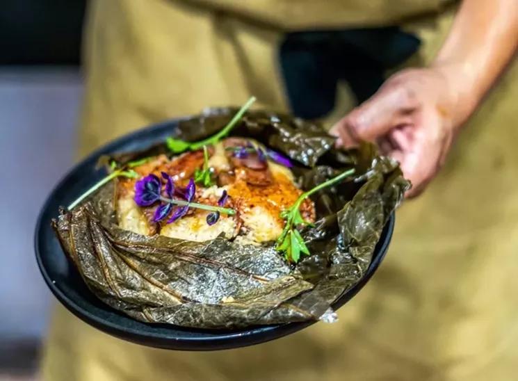 Lo mai gai, a specialty dish prepared with the house-made Chinese sausage known as lap cheong. - PHOTO BY JONATHAN DUARTE