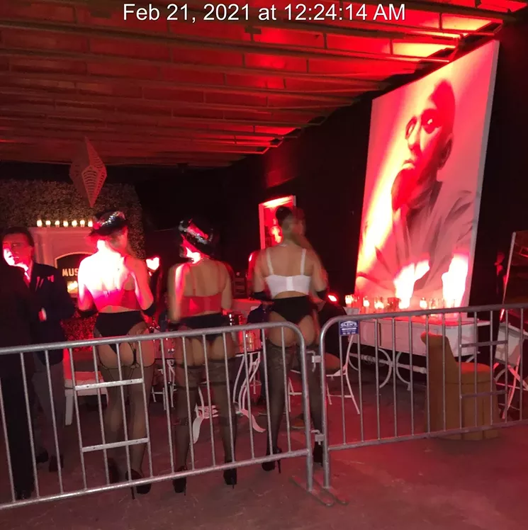According to Nicholson, the above photo shows Diaz de la Portilla (left) in a barricaded section of the after-hours party venue. - PHOTO VIA CITY OF MIAMI