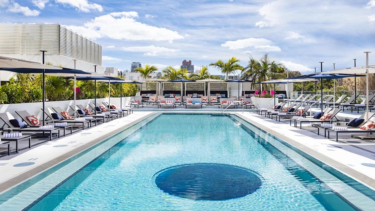 A rooftop pool includes a cutout with a view to Moxy Miami South Beach's lobby below. - PHOTO BY MICHAEL KLEINBERG