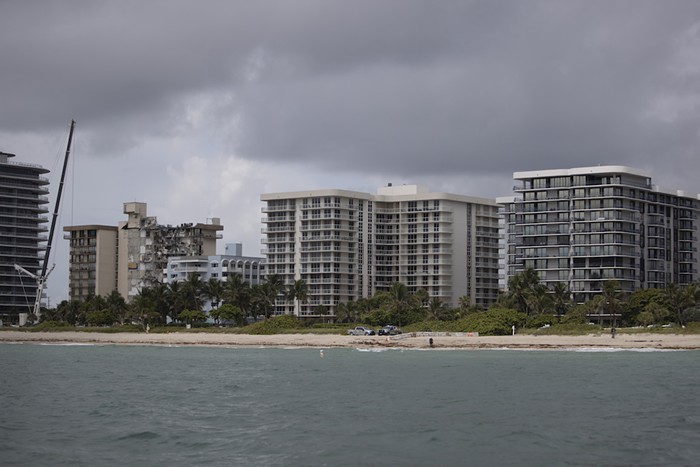 Surfside Mayor Charles Burkett recommended that residents of Champlain Towers North (far right) evacuate - PHOTO BY JOE RAEDLE/GETTY IMAGES