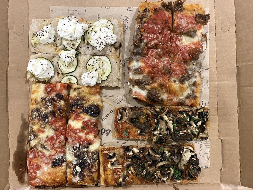 In the store, Bonci Pizza is cut with scissors and charged by the pound from a daily rotation of choices. But by delivery, you buy pairs of slices from a more limited menu. - PHOTO BY JEN KARETNICK