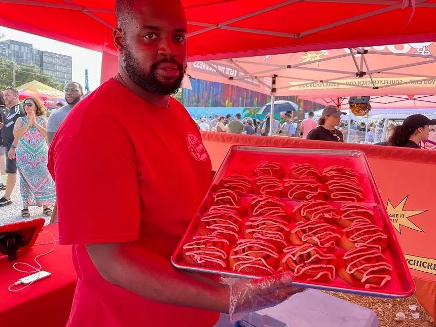 AJ Jean Pierre with a fresh batch of Sinnabuns - PHOTO BY LAINE DOSS