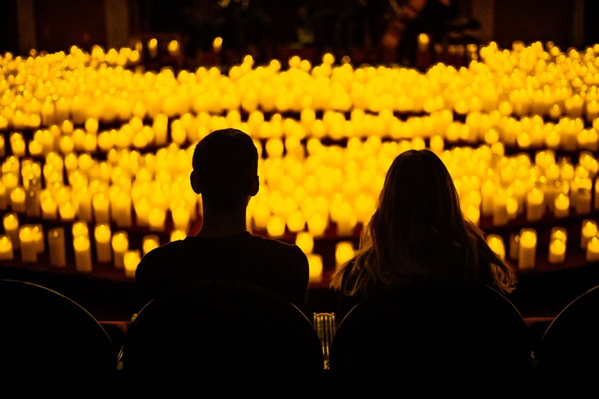 Silhouette of a couple surrounded by candles