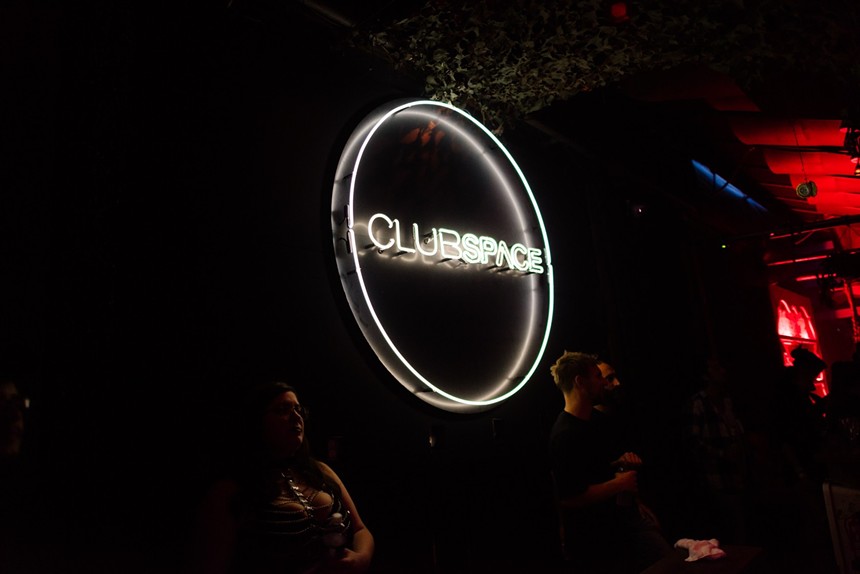 Club Space's logo as a neon sign inside the venue