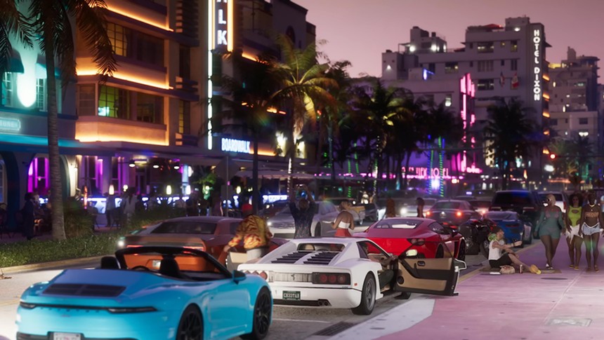 Fancy sports cars and neon-lit buildings in the video game Grand Theft Auto VI